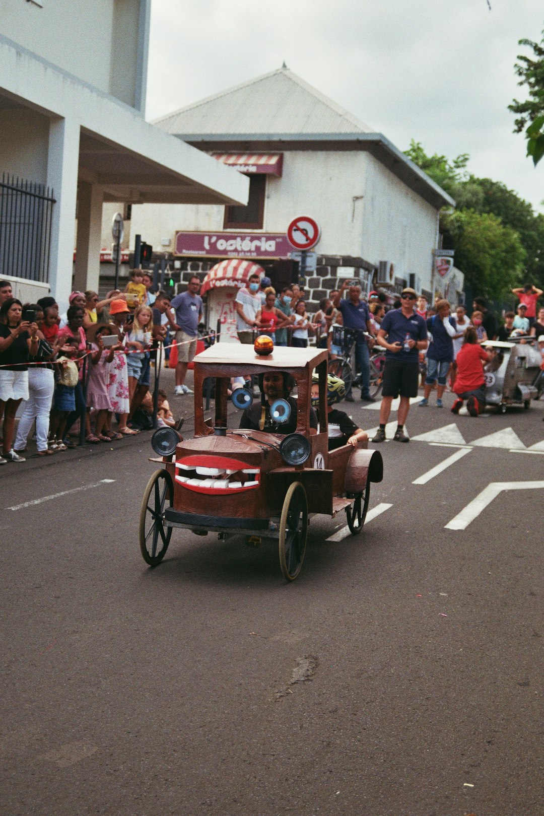 gallery-02 a-parade-with-cars-and-people-on-the-street-q5dx3bedbjy